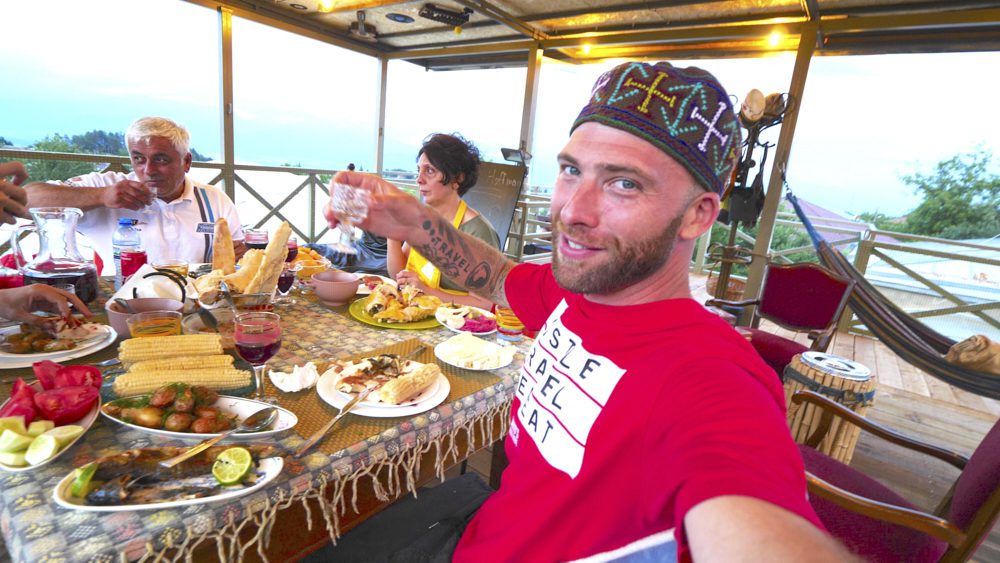 David Hoffmann enjoying a meal and drinks at Qilimcha's Guesthouse in Alazani Valley