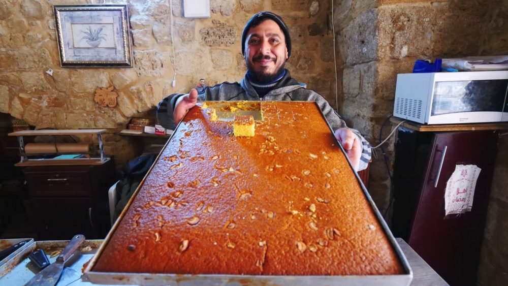 A baker selling sfouf in the Old Town 