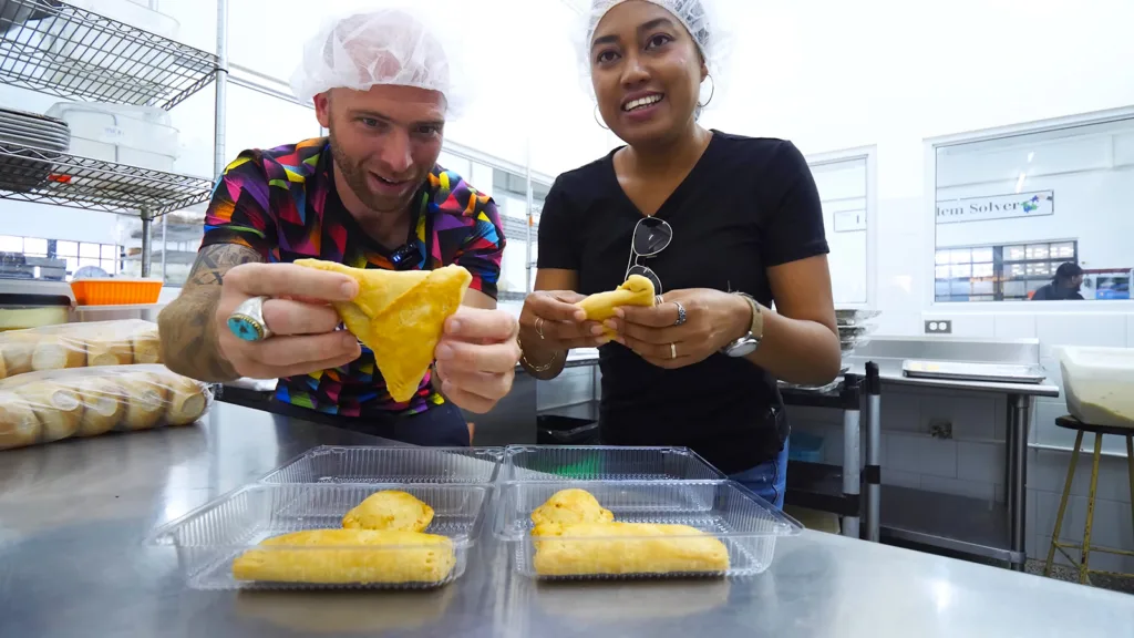 David Hoffmann and his local guide, Stacy, hold up two freshly-baked pine tarts in the kitchen at Maggie's Snackette | Davidsbeenhere
