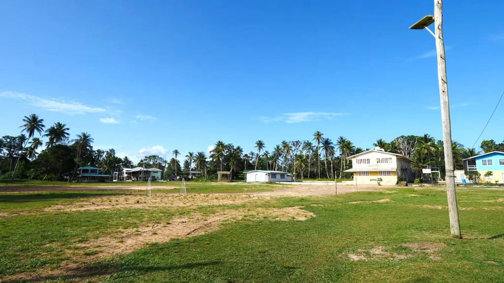 A volleyball field and several homes in the village of Moraikobai, Guyana | Davidsbeenhere