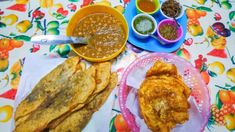 Aloo pies, chana, and Trini doubles on a table in Trinidad | Davidsbeenhere