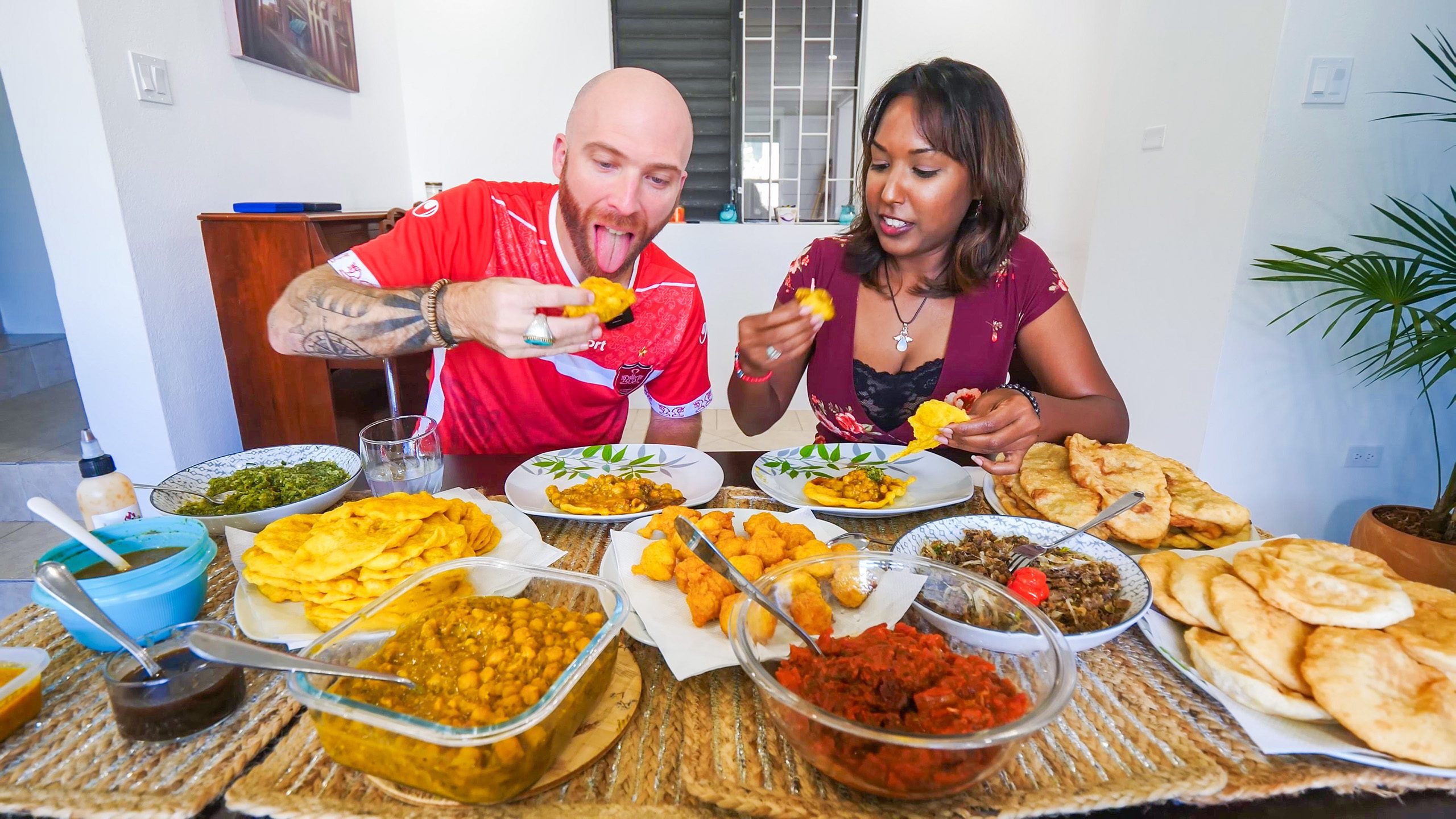 David Hoffmann and his friend Nerissa take their first bites of their Trini food breakfast in Barbados | Davidsbeenhere